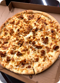 Fresh cheese pizza in a cardboard box.